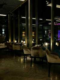 fine-dining destination perched atop the COMO The Treasury hotel, offering panoramic views