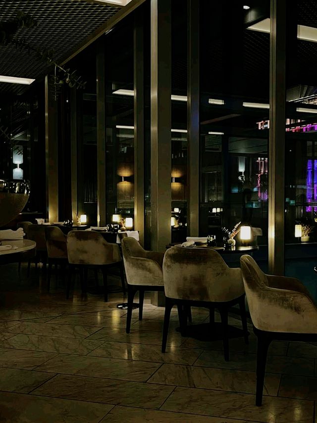 fine-dining destination perched atop the COMO The Treasury hotel, offering panoramic views