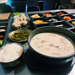 A perfect hearty Korean meal, served with noodles, various side dishes, and barley tea: Gaya Milmyeon Gukbap