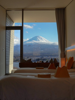 Dreaming of a lakeside escape with epic views of Mount Fuji? 🌄 HOSHINOYA Fuji is the ultimate glamping retreat right at Fujikawaguchiko, delivering luxury, tranquility, and those unbeatable landscape shots—perfect for unwinding and filling your feed with “wow” moments. You’ll love the peaceful vibe: the hotel is tucked into the forest, offering panoramic views of the iconic mountain from your private terrace and the sleek, modern rooms.

HOSHINOYA Fuji is located at 1408 Oishi, Minamitsuru District, just a short drive from Kawaguchiko Station. The rooms are pure bliss—heated floors, chic minimalist design, and plush beds (so comfortable you may never want to leave). The big Insta-worthy photo spot? Take sunrise shots from your glass-walled suite or step outside for dusk views of Fuji, wrapped in mist and forest. The hotel’s tranquil ambiance is a huge plus, but some guests report lapses in service (communication could improve) and that the location is remote, so plan ahead for transport and dining. Rooms and facilities are spotless and modern; you’ll feel pampered, but be aware pricing is on the higher end. If you’re craving peace and nature, it’s worth it!

Don’t miss: The firepit lounge for marshmallow roasting, canoeing on Lake Kawaguchi, or visiting the local Oishi Park Flower Fields. Quick tip—book early on trip.com for the best deals and request a Mt. Fuji-facing room. Plan for transport (hotel shuttles or rental car) as taxis can be sparse.

#Fujikawaguchiko  #LuxuryHotel  #MountFujiViews  #GlampingJapan  #Tripcom 