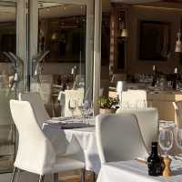 Upscale dining paired by a port view!