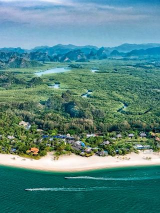 The Four Seasons Resort Langkawi is a hidden seaside paradise nestled between the blue sea and dense rainforest