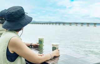 #adventuretrips  

Kampot’s secret chill spot? Starbucks! ☕️🌅 This cozy branch is way more than a caffeine fix—it’s got river views, clean wifi, and a prime location for both working and relaxing. Whether you’re backpacking or just need a break from the Khmer heat, it’s the perfect base to recharge.

Top Spot to Visit in Kampot:  
Starbucks Kampot—Street 735, Kampot 070801, Cambodia  
Opening hours: 7:00am–9:00pm. Come early for the best seats near the window and a quiet vibe.  
My hack? Order an iced Americano and snag the riverside lounge chairs—ideal for catching up on emails or just watching boats float by. The AC is a major bonus if you’re escaping from the midday sun!  

Practical Tips:  
– Wi-Fi is solid and doesn’t require any weird sign-ups.  
– Solo traveler? Staff are super friendly, and there’s zero pressure to rush your drink.  
– Power outlets available, perfect for digital nomads.

Getting Around Kampot is walkable and tuk-tuk rides are cheap (negotiate, should be $1–2 for short trips). Starbucks is easy to reach from the riverside area, and nearby street stalls mean you can grab local snacks after your coffee run.

Food Recommendation:  
Try their local dessert selection! Kampot Starbucks sometimes features coconut cakes and Cambodian twists on pastries—great for a sweet break.

Kampot Essentials:  
Cash is king, although Starbucks accepts cards. Bring bug spray if you’re sitting outside.

#KampotChill  #StarbucksAsia  #CambodiaTravel 