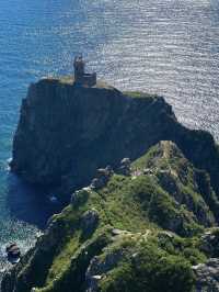 A beautiful lighthouse on a cliff
