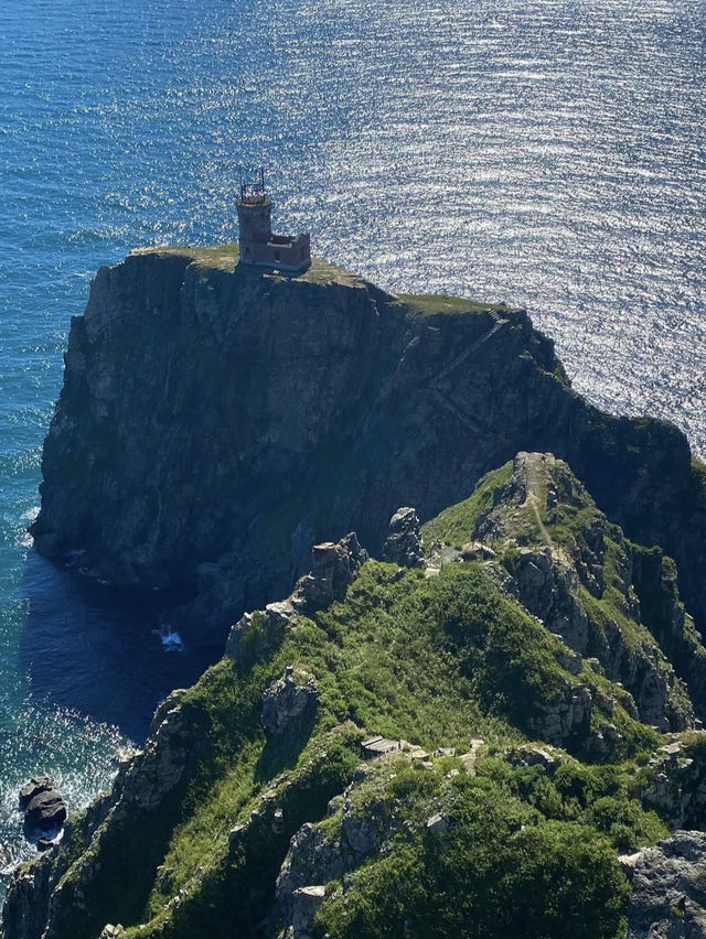 A beautiful lighthouse on a cliff