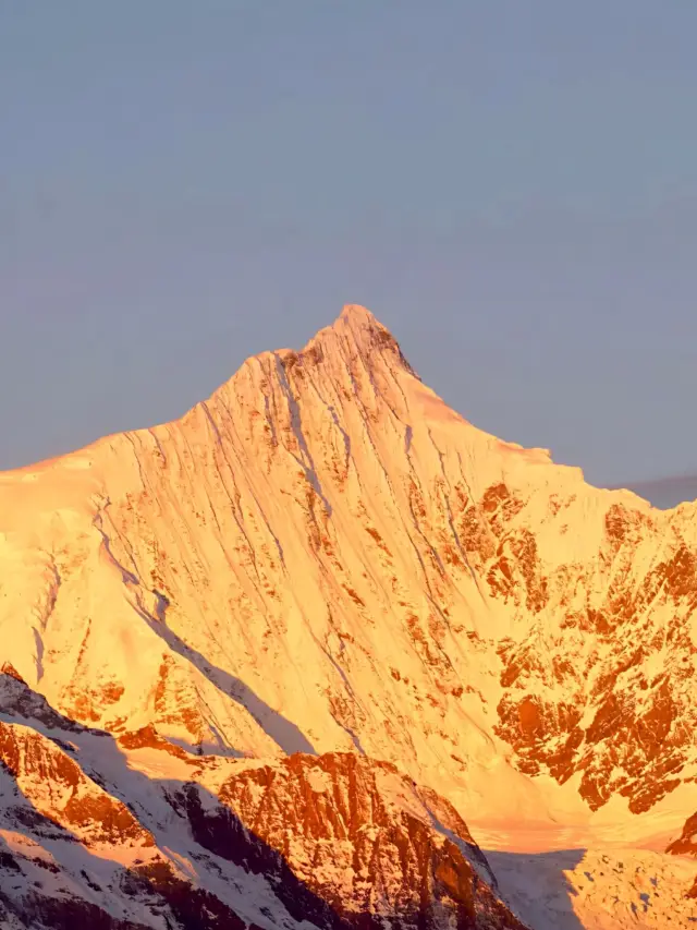 Embark on a journey to Meili Snow Mountain and encounter a breathtaking sunrise.