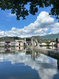 Crescent Reflections: A Journey Through Hongcun’s Timeless Mirror