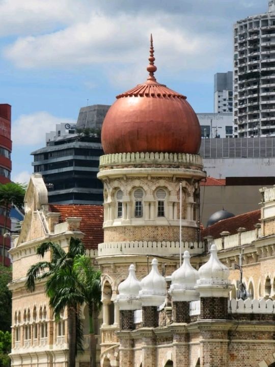 This historic iconic building looks magnificent and well-maintained, and is lit up with colorful lig