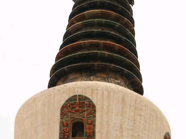 there is a temple hanging from the mountain...