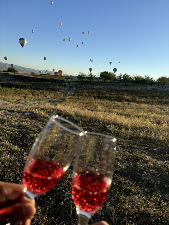 Sipping Sparkling Beneath Cappadocia’s Balloon-Filled Sky 🎈🥂