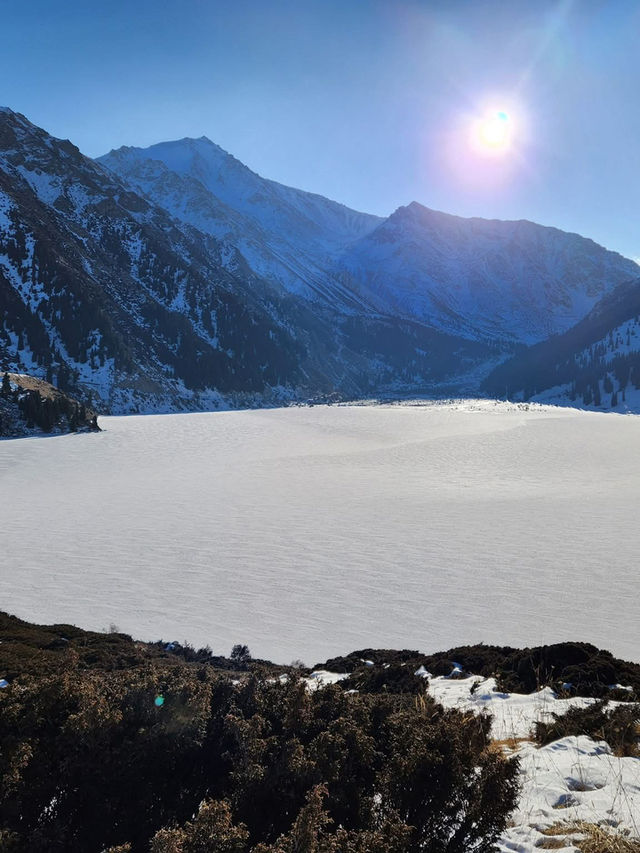Still waters, snowy peaks, and silence