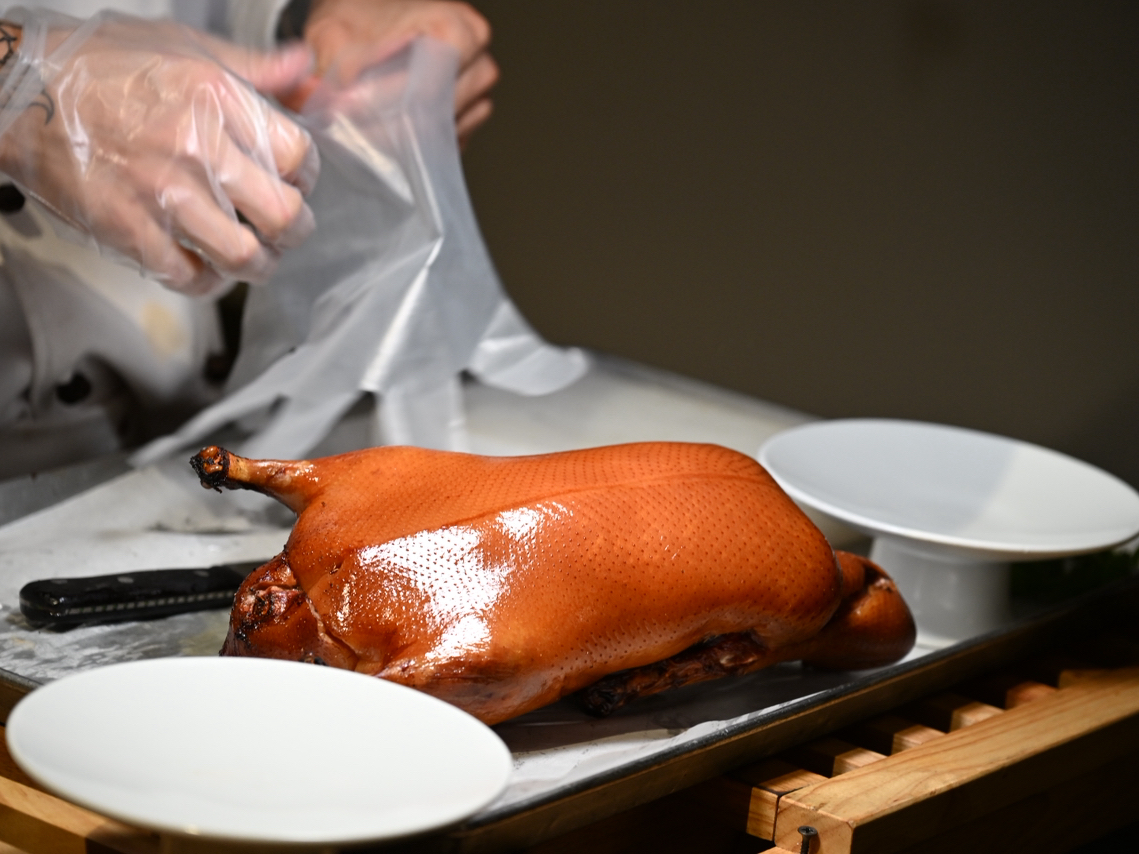 Beijing’s 四季民福 (Siji Minfu) is where serious foodies flock for authentic Peking duck and vibrant bites. This legendary spot has earned its fame for expertly roasted duck with crisp skin and juicy meat—be prepared to post some seriously drool-worthy photos! 

四季民福  
📍 Address: No.11 Nanchizi Street, Dongcheng District, Beijing, China  
🕙 Opening Hours: 10:30 AM – 9:00 PM  

Signature Dishes:  
Let’s start with their star—the Peking duck! It arrives tableside, expertly carved, and served with pancakes, sweet sauce, and scallions. Don’t miss their delicate green vegetable salad topped with golden crunchy bits (perfect for balance and freshness). The menu also offers traditional Beijing snacks and savory meat dishes.

Vibe/Ambience:  
The restaurant blends classic and modern Chinese décor, creating a warm, bustling atmosphere. It’s spacious enough for group gatherings, but book ahead—locals and tourists both love this place.

Key Strengths:  
四季民福’s duck is roasted in fruit wood for unique aroma and crispiness. The plating and presentation feel refined yet inviting. Service is efficient, and the salad—a hidden gem with that crunchy topping—is ideal for veggie lovers or as a palate cleanser.

Personal tip: Pace yourself with the duck and salad combo—don’t rush, savor each bite!  

Pro tip: Arrive early to avoid queues, and order the salad to balance your meal.

#Beijing #PekingDuck #ChineseFood #Foodie #TravelEats