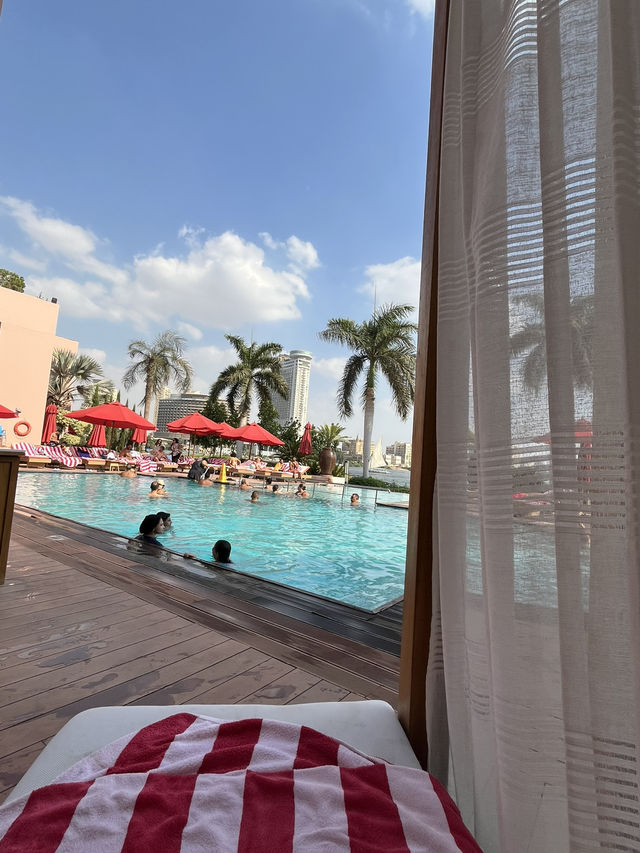 Poolside paradise… with the Nile as my infinity view 🛶☀️