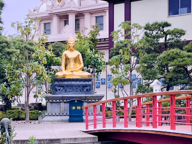 Spacious park with seasonal flowers and a peaceful pond,
