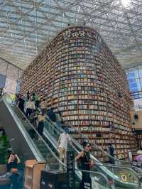 Lost in thought, surrounded by books