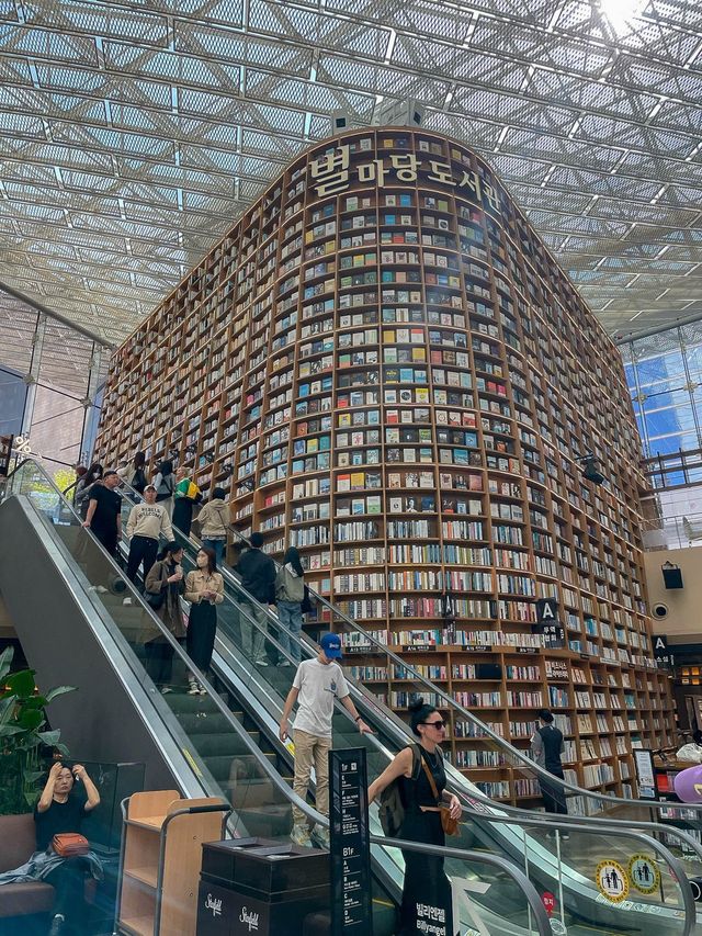 Lost in thought, surrounded by books