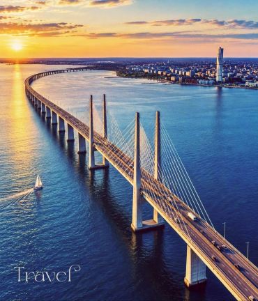 "Öresund Bridge at Sunset: Connecting Nations Across the Blue Horizon! 🌉🌅✨"