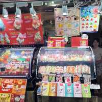 Colourful street market with many shops