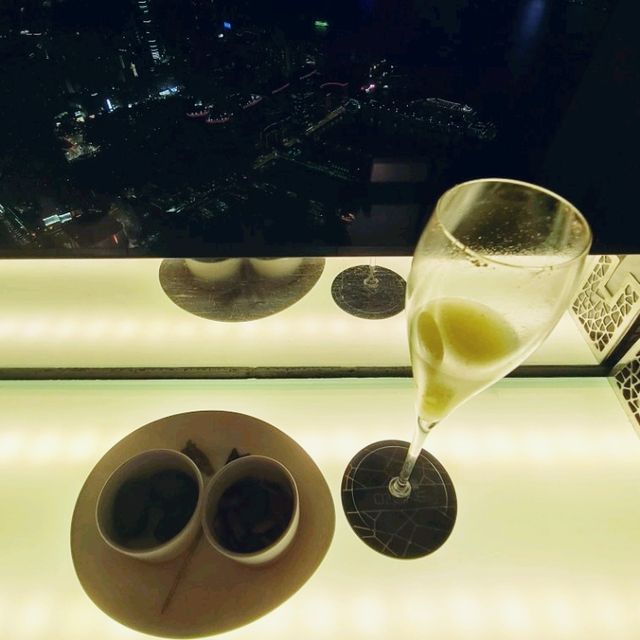 Sipping a drink at the top of Victoria Harbour