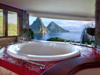 🏝️ Jade Mountain Resort, St. Lucia

🇱🇨 Jade Mountain Resort คือหนึ่งในโรงแรมที่มีเอกลักษณ์มากที่สุดในโลก ตั้งอยู่บนเกาะ St. Lucia ท่ามกลางวิวภูเขาไฟคู่ “Pitons” ที่โด่งดังระดับโลก รีสอร์ตแห่งนี้ถูกออกแบบให้เปิดโล่งแทบทั้งหมด เพื่อให้ผู้เข้าพักได้สัมผัสธรรมชาติแบบไร้ขอบเขต ทั้งทะเล แสงลม และภูเขาในมุมเดียวกันอย่างสมบูรณ์แบบ

✨ จุดเด่นที่สุดของ Jade Mountain คือการออกแบบ “ไม่มีผนังด้านที่ 4” ในห้องสวีท ทำให้ทุกห้องเปิดรับวิวทะเลแคริบเบียนและภูเขา Pitons แบบพาโนรามา ราวกับอยู่ในภาพวาดที่มีชีวิตจริง สร้างประสบการณ์การพักผ่อนที่ไม่เหมือนโรงแรมหรูใดๆ ในโลก

🛏️ ห้องพักหรือที่เรียกว่า “Sanctuary” มีสระว่ายน้ำอินฟินิตี้ส่วนตัวอยู่ภายในห้อง ทุกห้องมีดีไซน์แตกต่างกัน แต่เชื่อมโยงกันด้วยแนวคิดความเปิดโล่ง ความเป็นธรรมชาติ และความเงียบสงบระดับสูงสุด

🌅 อาหารเช้าเสิร์ฟพร้อมวิวทะเลแคริบเบียนและภูเขา Pitons แขกสามารถเลือกทานในห้องส่วนตัวหรือพื้นที่กลางแจ้ง เมนูเน้นวัตถุดิบสดใหม่จากท้องถิ่นและรสชาติแบบ Caribbean fusion

🛁 ห้องน้ำออกแบบแบบเปิดโล่ง ใช้วัสดุธรรมชาติ เช่น หินและไม้ พร้อมอ่างอาบน้ำที่สามารถชมวิวทะเลได้โดยตรง ให้ความรู้สึกผ่อนคลายอย่างลึกซึ้งและเป็นธรรมชาติที่สุด

🌊 บรรยากาศโดยรอบเงียบสงบและโรแมนติกมาก เหมาะสำหรับคู่รัก ฮันนีมูน หรือผู้ที่ต้องการหลีกหนีโลกภายนอกไปอยู่ท่ามกลางธรรมชาติที่สวยงามและสงบอย่างแท้จริง

🥾 กิจกรรมรอบรีสอร์ตมีทั้งดำน้ำชมปะการัง เดินป่าขึ้นภูเขา Pitons ล่องเรือชมพระอาทิตย์ตก และสปาที่เน้นการฟื้นฟูร่างกายแบบธรรมชาติ

📍 จุดเช็คอินรอบๆ • Gros Piton Viewpoint • Petit Piton Trail • Sugar Beach • Sulphur Springs Volcano • Caribbean Sea Sunset Point • Rainforest Hiking Trails • Anse Chastanet Beach

💎 Jade Mountain คือรีสอร์ตที่นิยามคำว่า “Luxury Meets Nature” ได้อย่างแท้จริง เป็นหนึ่งในโรงแรมที่ไม่เหมือนใครในโลก ทั้งด้านสถาปัตยกรรม วิวธรรมชาติ และประสบการณ์การพักผ่อนที่ลึกซึ้งระดับจิตใจ

#JadeMountain #StLuciaLuxury #CaribbeanResort #InfinityPoolSuite #LuxuryTravel #BucketListHotel #FiveStarResort #RomanticGetaway #WorldClassStay #NatureLuxury