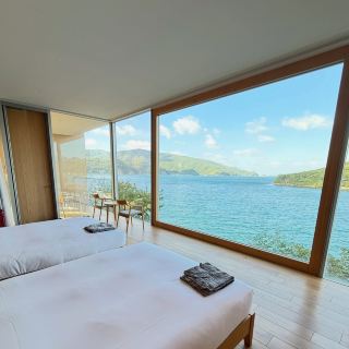 Heading off to Ama? Your first stop should absolutely be Ama-Entô for its ultra-peaceful vibes and jaw-dropping ocean scenery 🌊✨ This hidden spot is perfect for anyone chasing a blend of comfort, design, and authentic island flavor.

Must-Stay: Entô Hotel  
Address: 1375-1 Fukui, Oki District  
If you want a no-brainer on convenience and style, book at Entô. Located right next to the ferry port, stepping into Oki Islands seriously couldn’t be easier! Every room frames incredible sea and harbor views—perfect for sunrise or sunset snaps! The hotel’s strong wooden interiors and that fresh woody aroma give next-level comfort after a long day of exploring.

Why you’ll love it:  
· Don’t skip their breakfasts—everything’s made with local ingredients 🍳  
· Dinner is a highlight, so come hungry!  
· Rooms are sleek yet super cozy for ultimate chill-out time  
· Staff go above and beyond, making you feel like family

Practical tips:  
· Arriving? Just hop off the ferry and you’re basically at the lobby.  
· The area is best explored by bicycle or foot. Ask the staff for bike rentals or walking maps—they know all the secret lookout spots!  
· Cash is handy for small purchases since not everywhere accepts cards.  
· Pack for sea breezes—evenings can get cool regardless of the season!

#OkiIslands  #HiddenJapan  #IslandEscape  #JapaneseHotels 