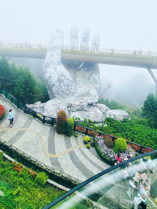 Misty weather didn't stop us from seeing the beauty of the Golden Hand Bridge in Danang 😍