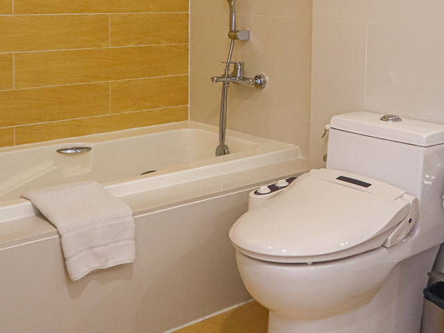 พักห้อง GRAND CORNER SUITE at Aster Hotel