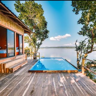 Wildwood Island Resort — Rangamati 🌊⛰️

Wildwood Island Resort offers a peaceful island-style stay surrounded by the natural beauty of Kaptai Lake in Rangamati. With water, green hills, trees, and a quiet atmosphere all around, it can be a great escape from the busy city.

Unlike a typical city hotel, the main attraction here is the opportunity to stay close to nature. Waking up to a lake view, enjoying a peaceful afternoon by the water, watching the sunset, and spending the evening in a quiet cottage can make the trip feel truly relaxing.

🏡 Cottage Experience

The cottage-style accommodation is one of the appealing parts of an island resort experience. If you prefer a private and nature-focused stay rather than a standard hotel room, a cottage can be a better choice.

If you are traveling as a couple or family, a private cottage with a lake view would be ideal if available. A balcony or outdoor sitting area can make the stay even more enjoyable, especially for morning tea or coffee overlooking the lake.

❤️ Perfect for Couples

For couples, an island-style resort can provide a peaceful and relaxing environment away from crowded tourist areas.

You can enjoy:

· 🏡 A private cottage
· 🌊 Lake views
· ☕ Morning coffee by the water
· 🚤 A private or shared boat trip
· 🌅 Sunset together
· 🍽️ A relaxing dinner
· 📸 Beautiful couple travel photos and videos

👨👩👧👦 Family Trip

The resort can also be suitable for a family getaway. If you travel with children, take extra care around the lake and follow all boat-safety instructions. Life jackets should always be used during boat trips.

📸 Perfect for Travel Content

The natural surroundings can provide plenty of opportunities for photography and social media content:

· 🌅 Sunset photography
· 🌊 Lake-view reels
· 🚤 Cinematic boat-ride videos
· 🌿 Green hill photography
· 🏡 Cottage photos
· ☕ Morning coffee shots
· ❤️ Couple travel reels

📅 Best Time to Visit

October to March is generally a comfortable period for visiting Rangamati, with pleasant weather for sightseeing and boat trips.

During June to September, the hills become much greener and the rainy-season scenery can be spectacular. However, heavy rain can sometimes affect transportation and boat activities.

💰 Cost

The current cottage and room rates can vary depending on the season, cottage type, number of guests, and booking date. It is best to confirm the latest price directly before booking.

Before making a reservation, check:

Cottage price + food charges + boat transfer + check-in/check-out times + extra-person charges + cancellation policy.

Wildwood Island Resort = 🌊 Kaptai Lake + 🏡 Cottage + 🌿 Nature + ⛰️ Hills + 🌅 Sunset + 🚤 Boat Ride

#WildwoodIslandResort #WildwoodResort #Rangamati #KaptaiLake #RangamatiTravel #RangamatiResort #RangamatiCottage #IslandResort #LakeView #CottageStay #BangladeshTravel #TravelBangladesh #NatureResort