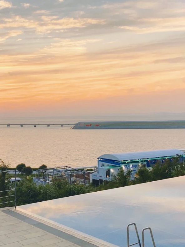 Okinawa vacation | soak in a private hot spring and watch the sunset, don't miss it if you love watching airplanes.