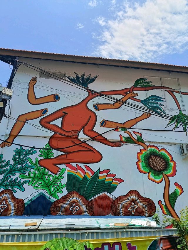 Citra Sasmita's enigmatic wall art at the Bali Kuta bus station.