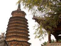 there is a temple hanging from the mountain...