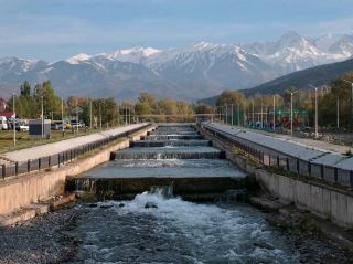 Visit the city of Esik, nestled amidst the snow-capped mountains of Kazakhstan.