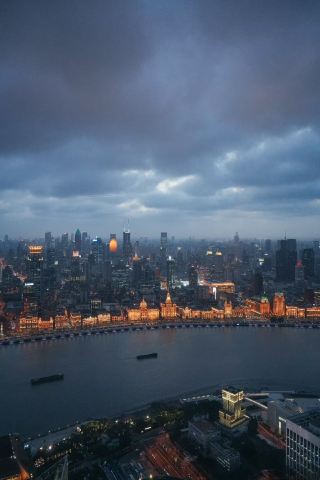 Check in at The Ritz-Carlton Shanghai, overlooking the Huangpu River, with the Oriental Pearl Tower just within reach