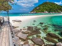 stunning beaches, crystal-clear waters, and lush palm-covered hills
