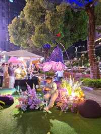 PURPLE FLOWERS AND GLOWING LIGHTS IN SHUNCHENG SHOPPING MALL