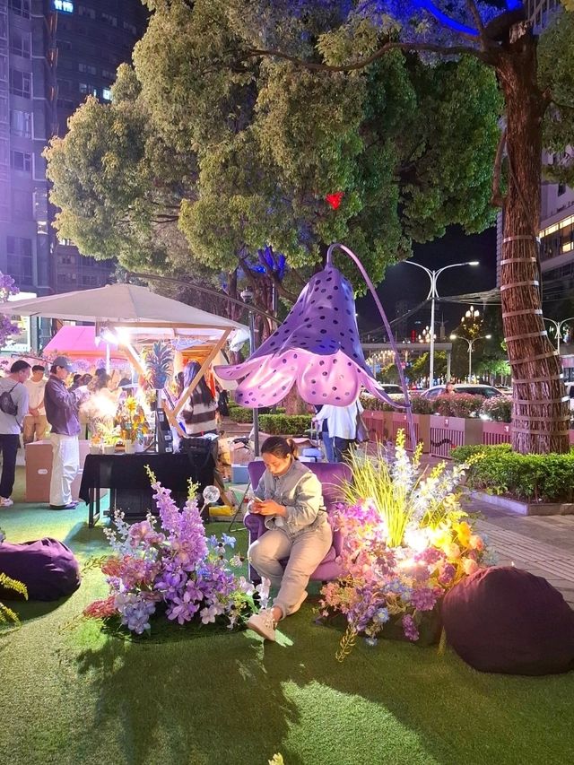 PURPLE FLOWERS AND GLOWING LIGHTS IN SHUNCHENG SHOPPING MALL