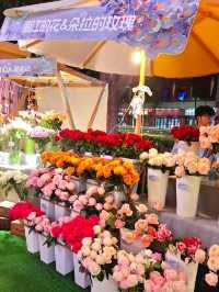 PURPLE FLOWERS AND GLOWING LIGHTS IN SHUNCHENG SHOPPING MALL