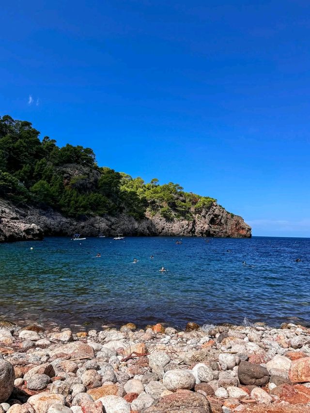 Turquoise Dreams and Sandy Toes at Cala Llombards