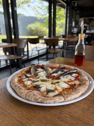 A spectacular view paired with delicious pizza! We recommend the half-and-half option for an extra 300 yen.