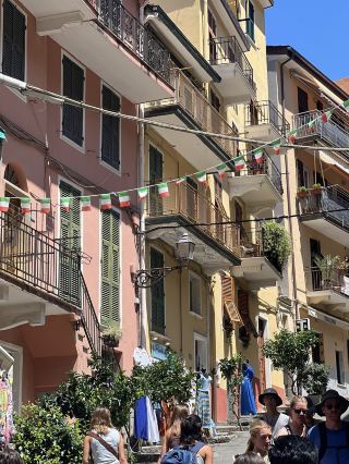 Walking through the colorful alleys, a village of captivating hues in Manarola.