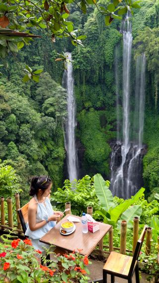 Go Chasing Waterfalls & Views at Sekumpul 🏞️💦🍽️  
Ready for a true Bali adventure? Sekumpul Waterfall isn’t just the island’s most photogenic cascade, it’s a whole journey—starting with a thrilling motorbike ride led by talented locals, and ending at a hidden jungle restaurant where dreams meet sky-high views.

The adventure begins with a bumpy, lush ride deep into Buleleng’s green hills—trust the pros on those narrow tracks! At the Sekumpul Waterfall View Point (R5FJ+5R2, Lemukih), your first jaw-drop moment awaits: snap sweeping panoramas from the top with the cascades tumbling through the jungle below. The best angle? Frame the falls with overhanging palms just before the main viewpoint deck—the ultimate “I’m in Bali” Insta-shot.

Next, if you’re feeling energetic, trek down to the base (allow 30-45 minutes each way). Wading into the cool spray is a total must, but pack sturdy non-slip footwear and a rain jacket for the mist. Not up for hiking? Linger up top: there’s an open-air restaurant and bar perched above the valley. Sip a chilled coconut or dig into nasi goreng as waterfalls roar in the distance—a highlight for scenery seekers and foodies alike.

Don’t forget: cash is king for entrance fees and food; bring a poncho (weather pops quickly!); and leave valuables behind during the trek (things get wet). Early mornings see gentler crowds and the finest light for photos

#Bali  #WaterfallAdventure  #SekumpulFalls  #JungleDining  #TravelTips 