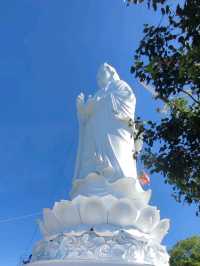 Peace and tranquility beside a giant Buddha.