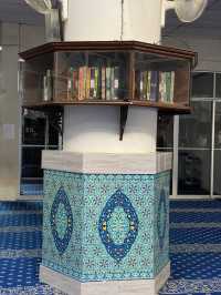 The mosque features intricate Islamic calligraphy 