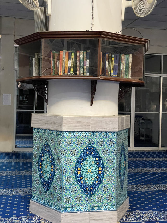 The mosque features intricate Islamic calligraphy 
