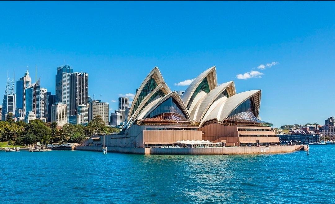 Sydney Opera House — The Iconic Beauty of Australia 🇦🇺✨

Standing gracefully beside the sparkling waters of Sydney Harbour, the Sydney Opera House is one of the most recognizable architectural landmarks in the world. Its distinctive sail-shaped roof, elegant white design, and breathtaking waterfront setting make it a symbol of Australia's beauty and creativity.

Located at Bennelong Point in Sydney, this world-famous performing arts venue is admired for both its remarkable architecture and its cultural significance. Visitors can enjoy spectacular views of the Opera House from the harbour, take a scenic ferry ride, or explore the surrounding area on foot. The nearby Royal Botanic Garden and Sydney Harbour Bridge offer wonderful opportunities for photography and sightseeing.

The Opera House looks especially beautiful in the soft light of sunrise and sunset, when the harbour reflects the changing colours of the sky. Whether admired from the waterfront or experienced through a performance, it remains an unforgettable highlight of Sydney.

If you're exploring Sydney, consider visiting Sydney Harbour Bridge, Royal Botanic Garden Sydney, and Circular Quay as well. These nearby attractions offer even more memorable views of the city's iconic harbour.

📍 Location: Bennelong Point, Sydney, New South Wales, Australia

#sydneyoperahouse  #sydneyaustralia  #australiatravel  #sydneyharbour  #architecturelovers  #travelphotography  #tripmoments #naturalwonders #travel #travel2026 