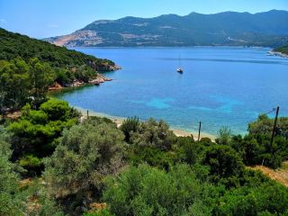Chondri Ammos — The Greek Village Where the Pebble Beach Meets the Pines and the Sea Glitters Foreve