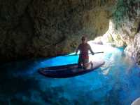 Paddleboarding and cliff jumping at secret caves in Ibiza