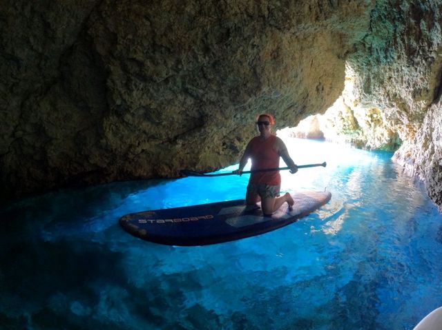 Paddleboarding and cliff jumping at secret caves in Ibiza