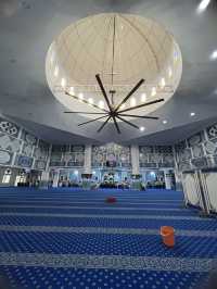 The mosque features intricate Islamic calligraphy 
