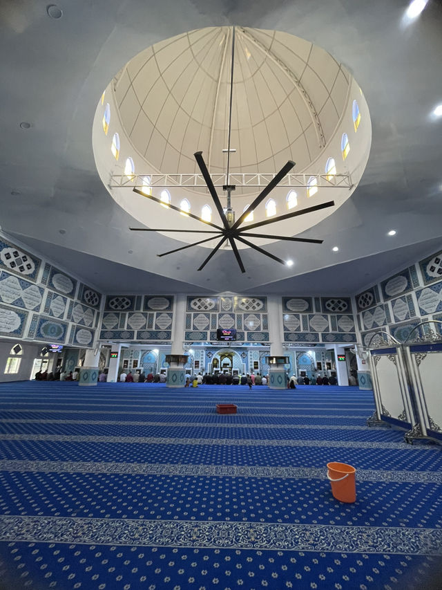 The mosque features intricate Islamic calligraphy 